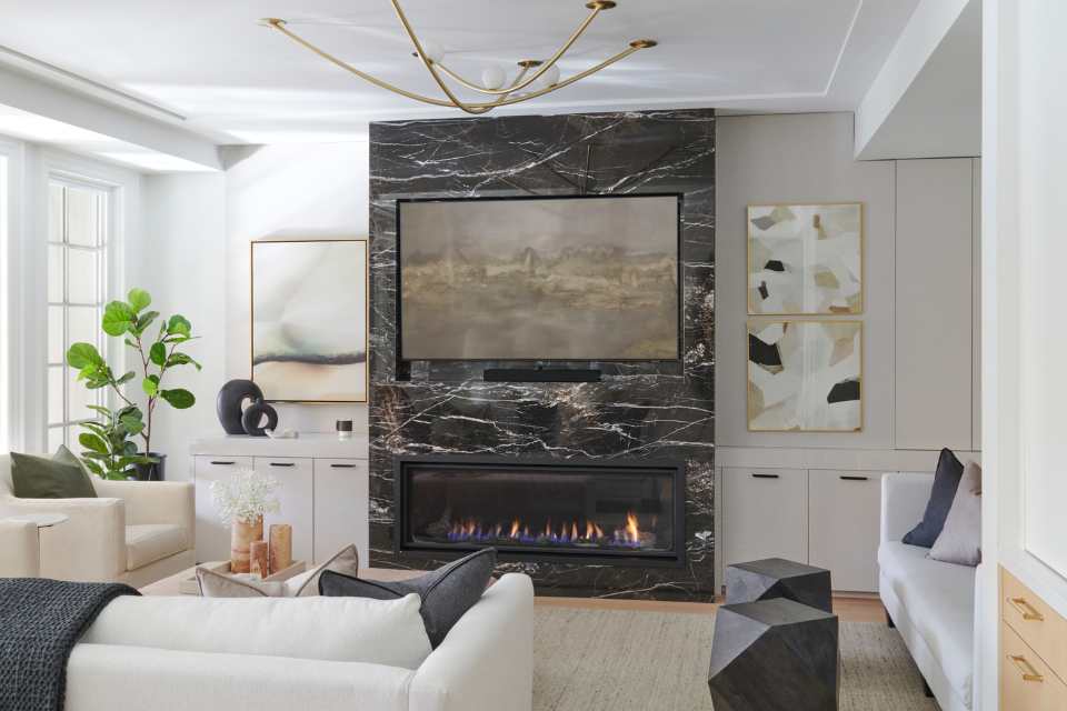 neutral color palette in modern living room with great marble fireplace